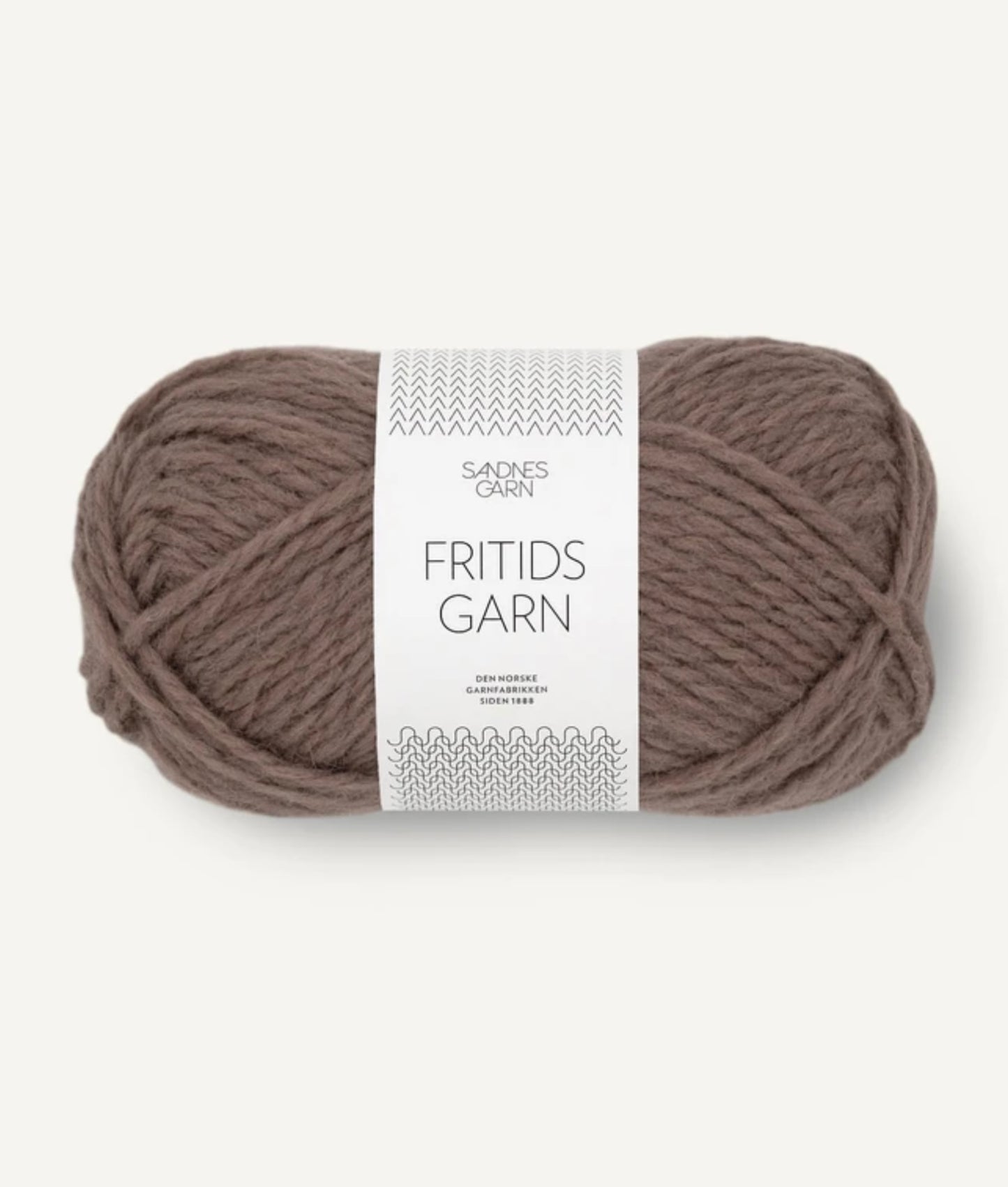A skein of light cocoa yarn labeled "Agave Designs Light Cocoa Wool Slipper" is shown. The medium-thick Norwegian wool is neatly wound into an oval shape, with a white label featuring branding, care instructions, and a size chart wrapped around the center.